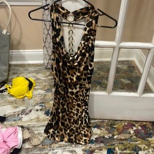 Lessors dress with a gold chain down the middle of the back,